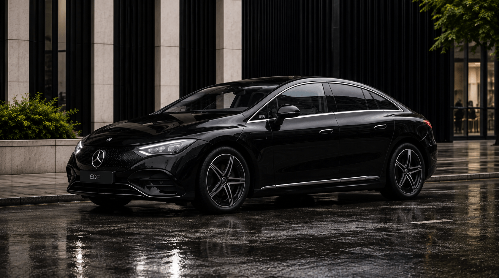 Black Mercedes-Benz EQE parked outside a modern building